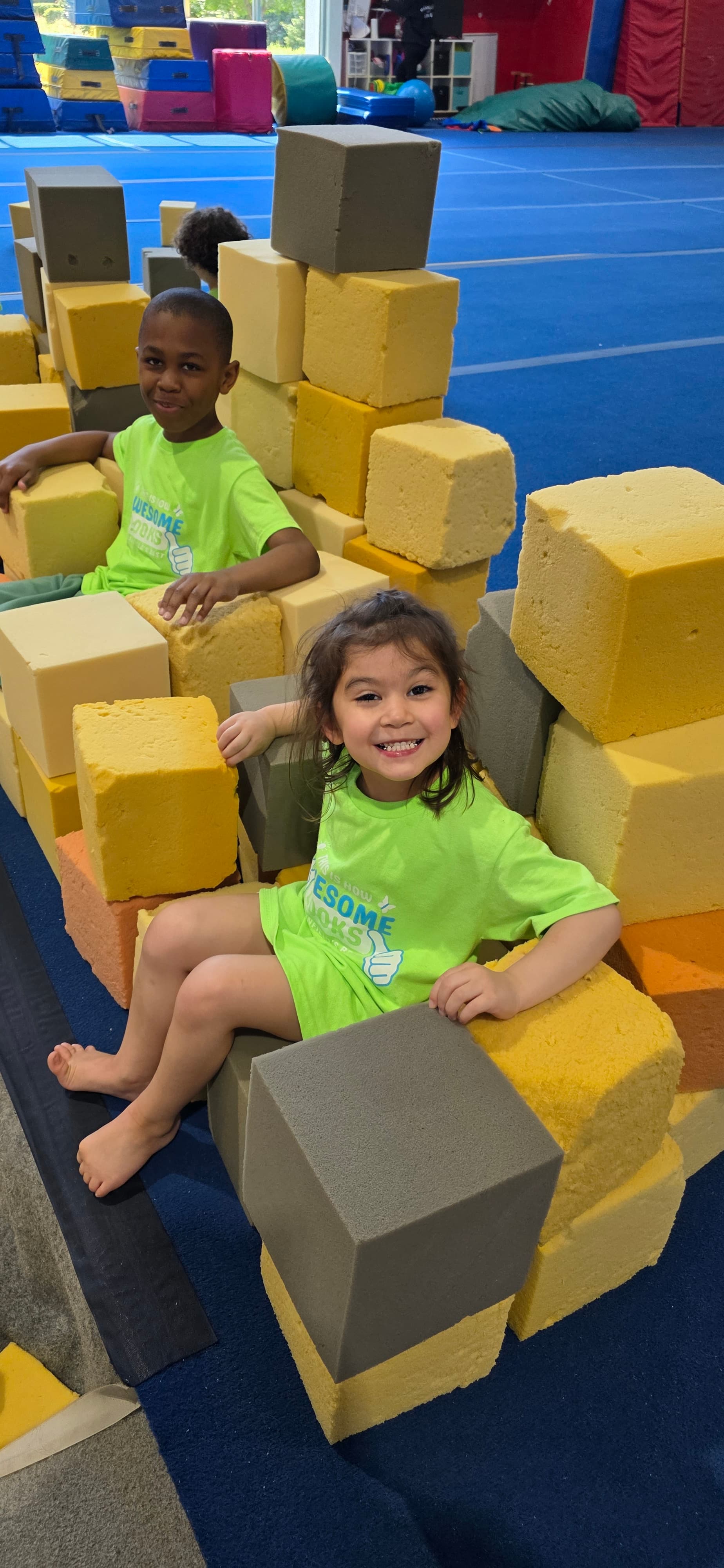 Camper smiling in a foam pit
